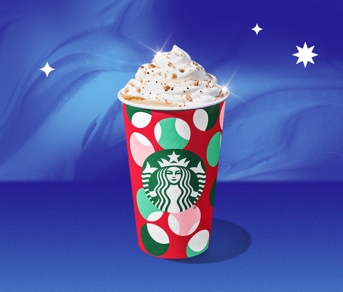 A Starbucks holiday beverage in a takeaway cup