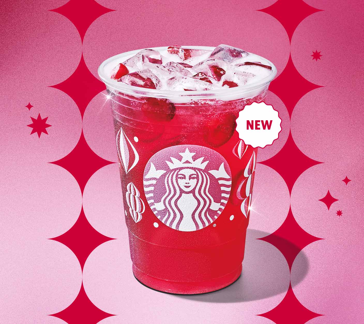 New | A bright red translucent beverage in a festive patterened cup