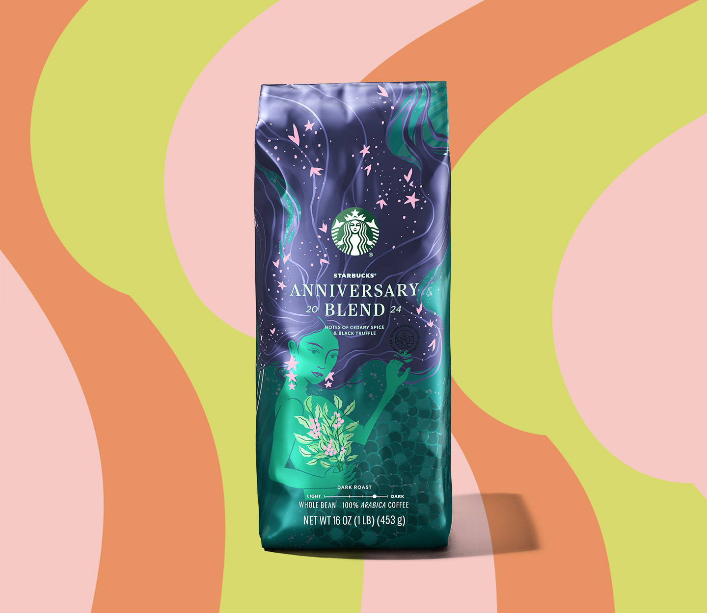 Un sac de café bleu foncé arborant la sirène Starbucks illustrée en vert.